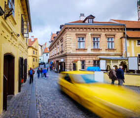 Wall Mural - Historical street with small houses full of tourists