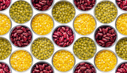 Wall Mural - Seamless background of flat lay opened tin cans with green peas, sweet corn and kidney beans isolated on white background. Clipping path added