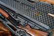 © AlexR - a disassembled 12 gauge hunting shotgun and cleaning kit in a gray gun case