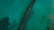  Aerial Breakwater Of Stone In The Sea, Oahu, Hawaii