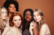 © iordani - young pretty asian, caucasian, afro woman posing cheerful together on brown background, lifestyle diverse nationality people concept