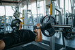 © bnenin - Fitness man with strong arms and muscles.