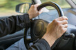© Anna Pecherskaia - male hands on the steering wheel, driving a car. The concept is learning to drive, driving safely, traveling by car. soft, selective focus, horizontal photo.