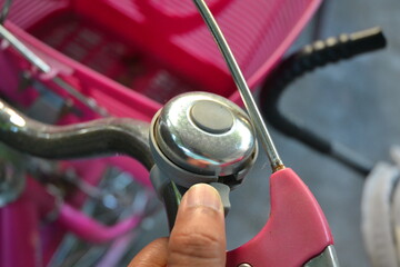 a bicycle bell and a hand.