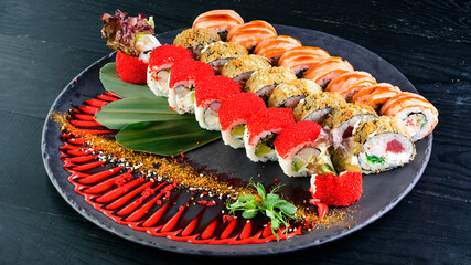 Wall Mural - large set of sushi on a round plate