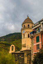 Nice Close-up View Of The Famous Octagonal Bell Tower With A Yellow Façade, A Dome And A Clock Which Belongs To The Church Of Santa Margherita D'Antiochia In Vernazza In The Cinque Terre Coastal Area.