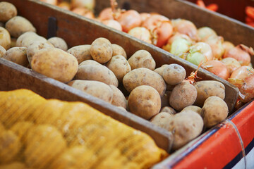 Large heap of fresh ripe organic potatoes on farmer market in Paris