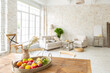 © 4595886 - Large spacious room with a trendy loft design of sitting area. huge windows and stylish wicker light furniture inside. an abundance of ethnic decor