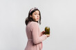 © LIGHTFIELD STUDIOS - surprised and pregnant woman holding jar while eating pickled cucumbers isolated on white