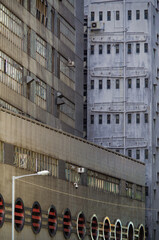 Residential area in old apartment with windows. High-rise building, skyscraper with windows of architecture in urban city of Hong Kong or Hongkong, China run-down decay