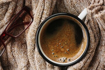 Americano coffee and a knitted sweater macro