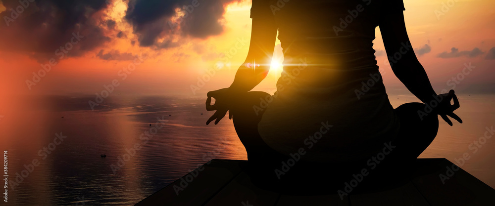 The silhouette of woman sitting yoga alone,Relax and meditate,mental health concept with nature spiritual. - obrazy, fototapety, plakaty 