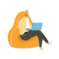 Sticker - young man working in laptop seated in sofa