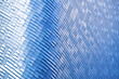 © gumpapa - modern metal and glass modern background or wall of architecture design with blue light. abstract structure of spaceship wall interior and exterior or modern building.