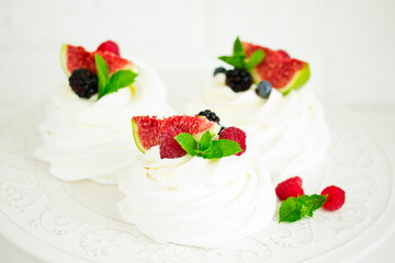 Wall Mural - Pavlova's meringue dessert with berries and fruits