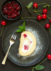 Wall Mural - Sponge cake roll with cherry and cream. Selective focus