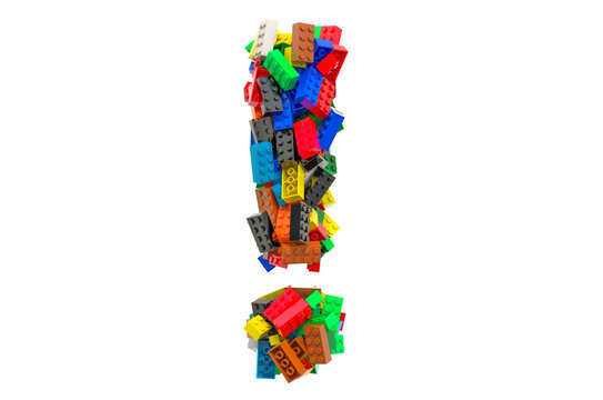Exclamation mark from colored plastic building blocks, 3D rendering