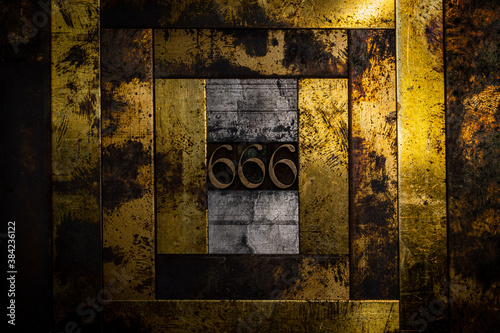 Cuadros en Lienzo Photo of real authentic typeset letters forming number 666 on vintage textured g