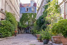 Paris, France - June 24, 2020: Passage Lhomme, One Of The Romantic Courtyards In The East Of Paris, France. These Bucolic, Unusual And Hidden Spots Are Delightful Gems To Explore