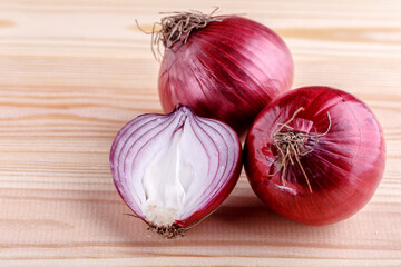 red onions on rustic wood