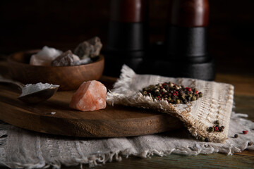 
Salt and pepper on a wooden table in rustic style