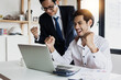 © khwanchai - business people looking at laptop and celebrate and glad after office achieve profit and get goal