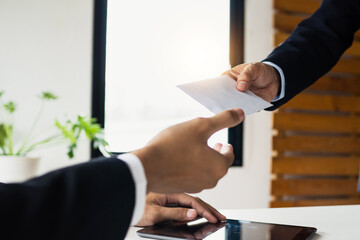 Wall Mural - give and get profit, close up hand of businessman take envelope of money from boss