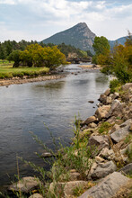Lake Estes In Estes Park Colorado, View Of The River With A Bridge And Mountain In The Background