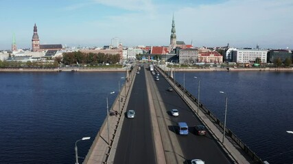 Wall Mural - a panoramic video of the car traffic bridge that spans the river daugava in the latvian capital of r