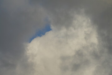 Wall Mural - Clouds with some blue sky in the background