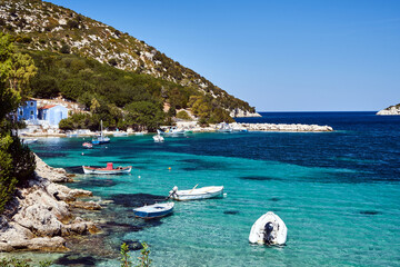 Wall Mural - Boats in a rocky bay on the island of Kefalonia