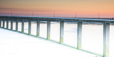 Wall Mural - Wooden pier and colourful sunset sky in Amble, Northumberland