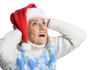 Poster - Portrait of happy senior woman in Santa hat