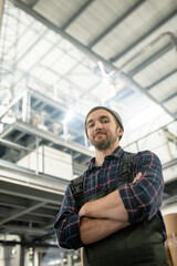 Aufkleber - Young successful male worker of large factory in shirt, beanie and coveralls