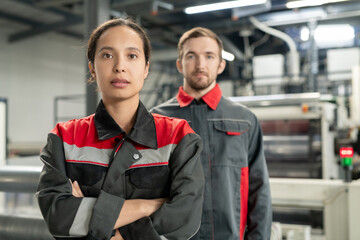 Aufkleber - Young serious pretty female leader of workteam keeping her arms crossed by chest
