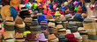 © jobi_pro - Stacks of fashionable hats in different styles and colors in the hat shop