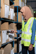 © vichie81 - Asian Islam Muslim warehouse worker do inventory