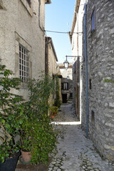  A narrow street between the old houses of Fumone, a medieval village in the province of Frosinone, Italy.