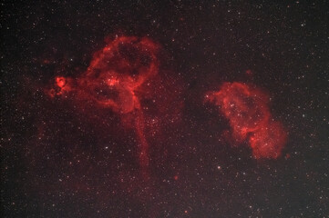 Wall Mural - the heart (ic 1805) and soul (ic 1848) nebulae , two hydrogen alpha rich nebulae glowing in the nigh