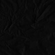 © artistmef - Black vintage and old looking crumpled paper background. Retro cardboard texture. Grunge paper for drawing. Ancient book page. Present wrapping.