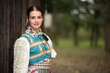 © muro - Slovak folklore. Traditional costume. Beautiful girl in traditional dress.
