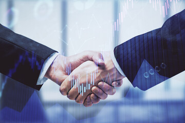 Double exposure of forex graph hologram and handshake of two men. Stock market concept.