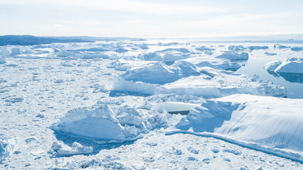 Wall Mural - drone photo of iceberg and ice from glacier in arctic nature landscape on greenland. aerial photo dr
