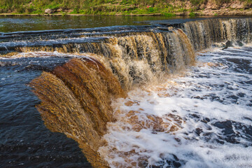 Waterfall, water flowing from the river falls down