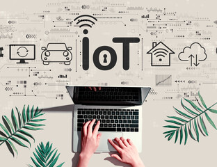 IoT theme with person using a laptop computer