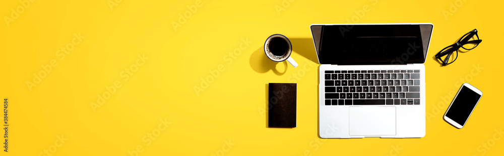 Laptop computer with a smartphone and office objects - obrazy, fototapety, plakaty 