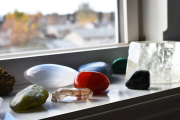 Wall Mural - A close up image of healing crystals recharging on a windowsill.