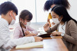 © JR-50 - A group of Kids students wearing medical masks in the classroom.
