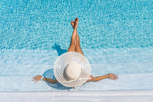 Woman In Luxury Spa Resort Near The Swimming Pool.