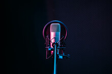 Studio Microphone And Pop Shield On Mic In The Empty Recording Studio With Copy Space. Performance And Show In The Music Business Equipment.